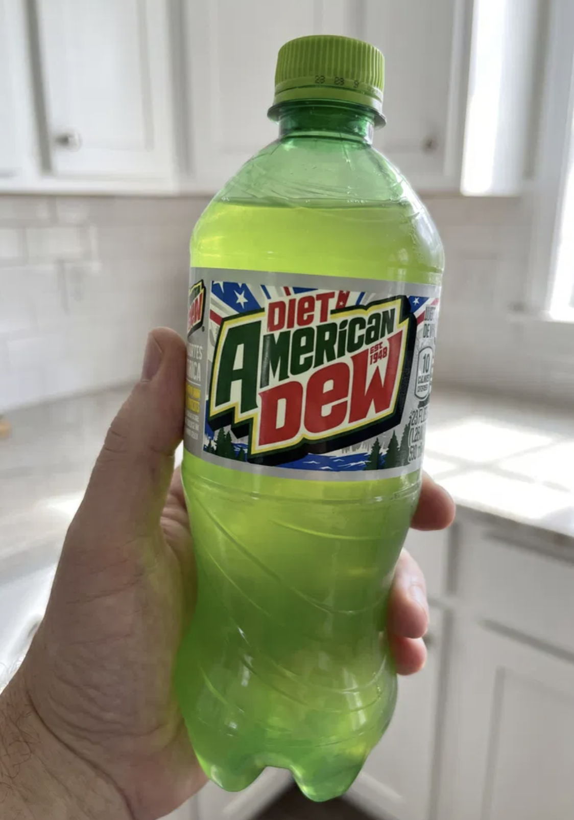 Person scanning a Mountain Dew bottle on AmericanDEW.com to enter the sweepstakes