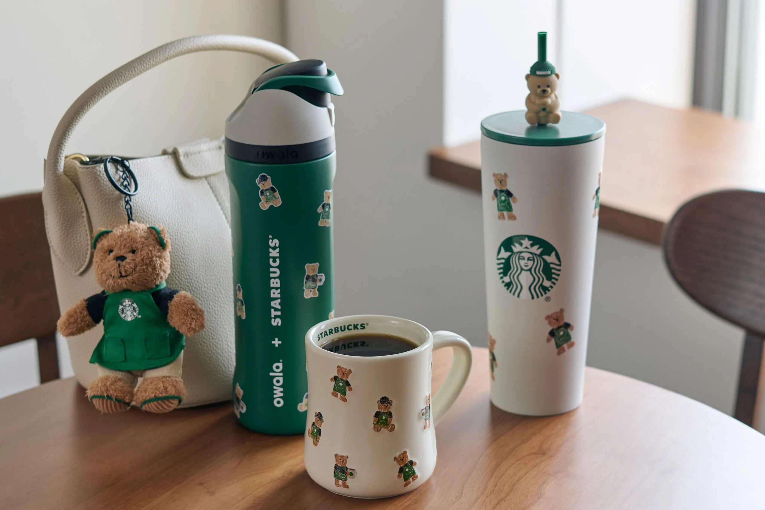 Official 2026 Starbucks Bearista holiday collection with bear-decorated drinkware and a plush keychain